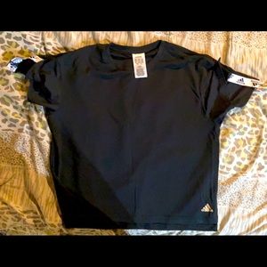 adidas top-never worn. Can fit size S/Med. Smoke and pet free home